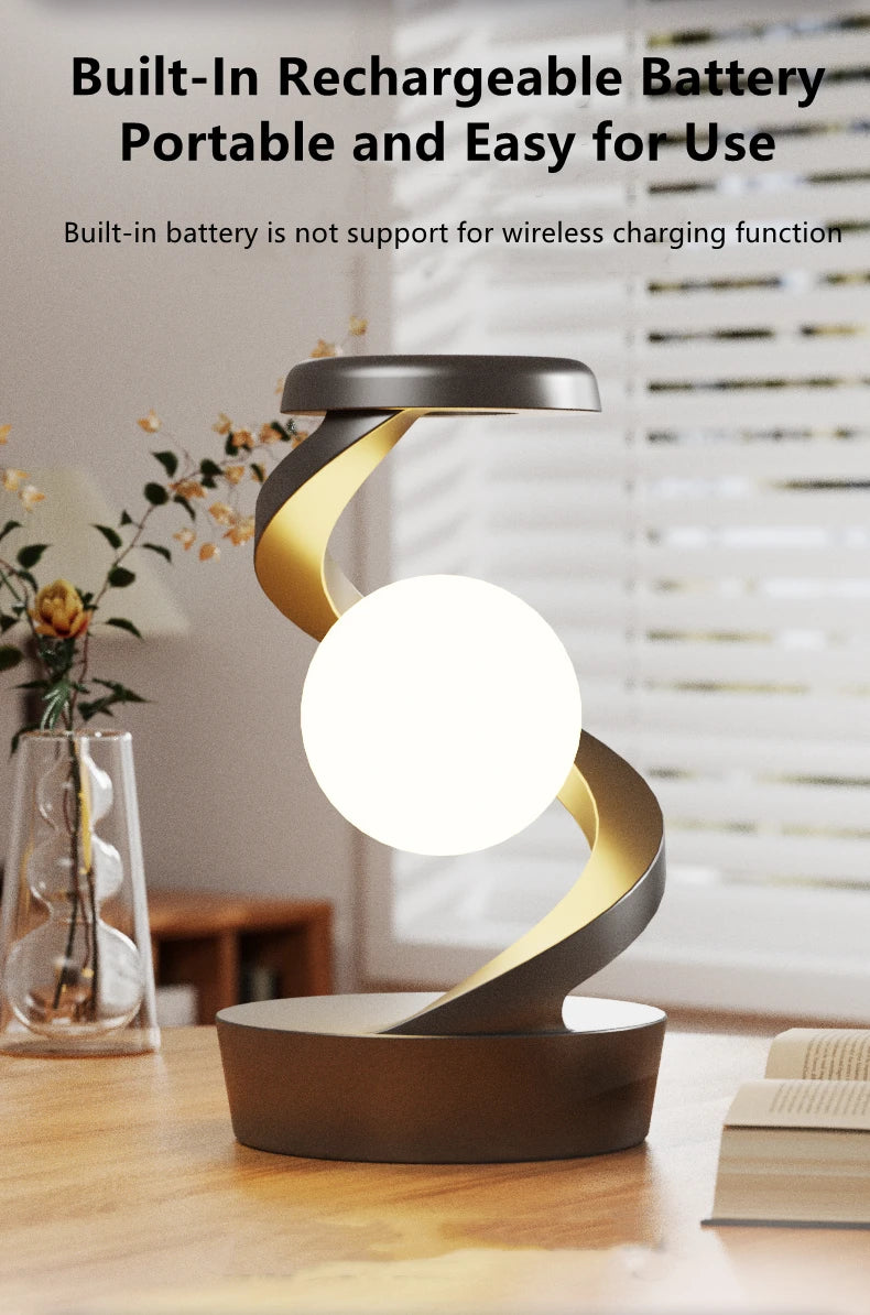Floating wireless charging lamp with warm glowing orb and dark base stand