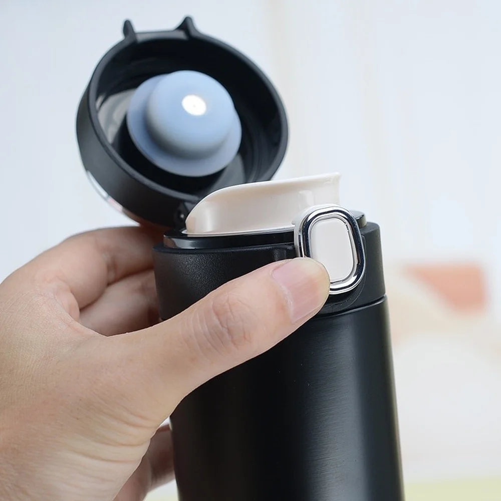 Compact smart thermos lid open showing inner cup, black