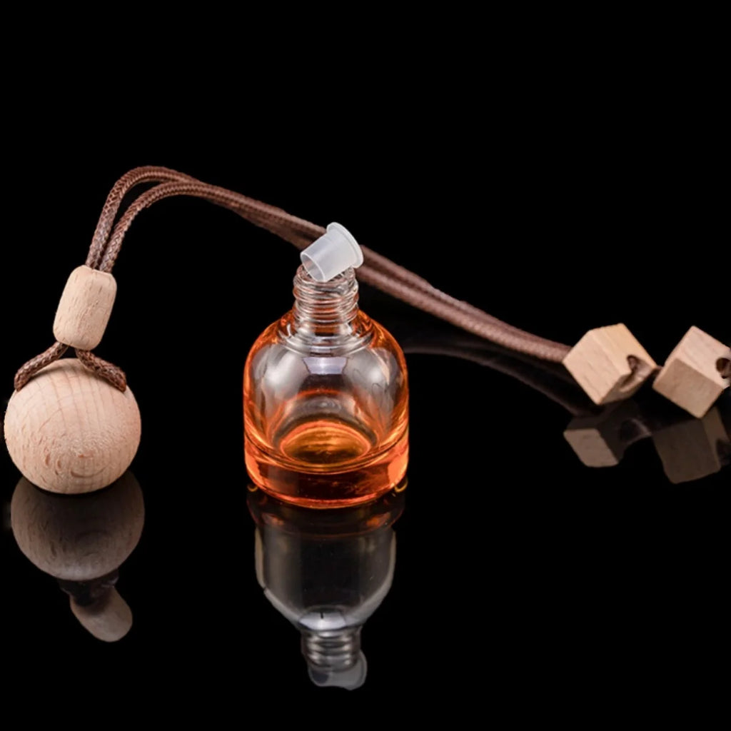 Mini Glass Car Perfume Diffuser in golden amber glass, wood balls and hanging strap