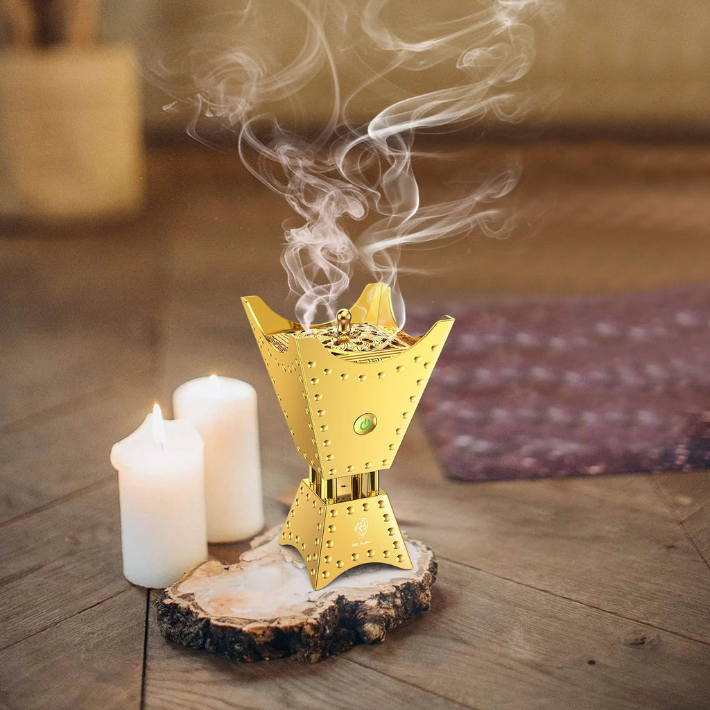 Gold electric incense burner on round wood base with candlelight and smoke