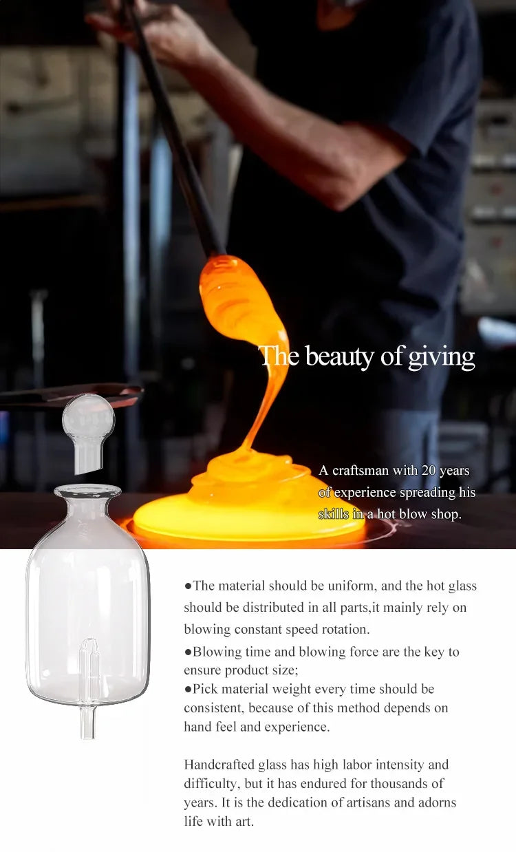 Glass essential oil diffuser with glowing mist pouring from a clear bottle