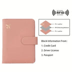 Blush pink passport wallet with airplane emblem and RFID blocking material panel