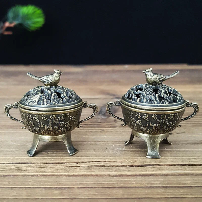 Set of two copper lotus incense burners with bird-topped lids on short feet