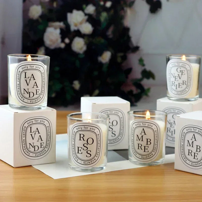 Romantic glass jar scented candles on display; flames and “LA VANDE” label