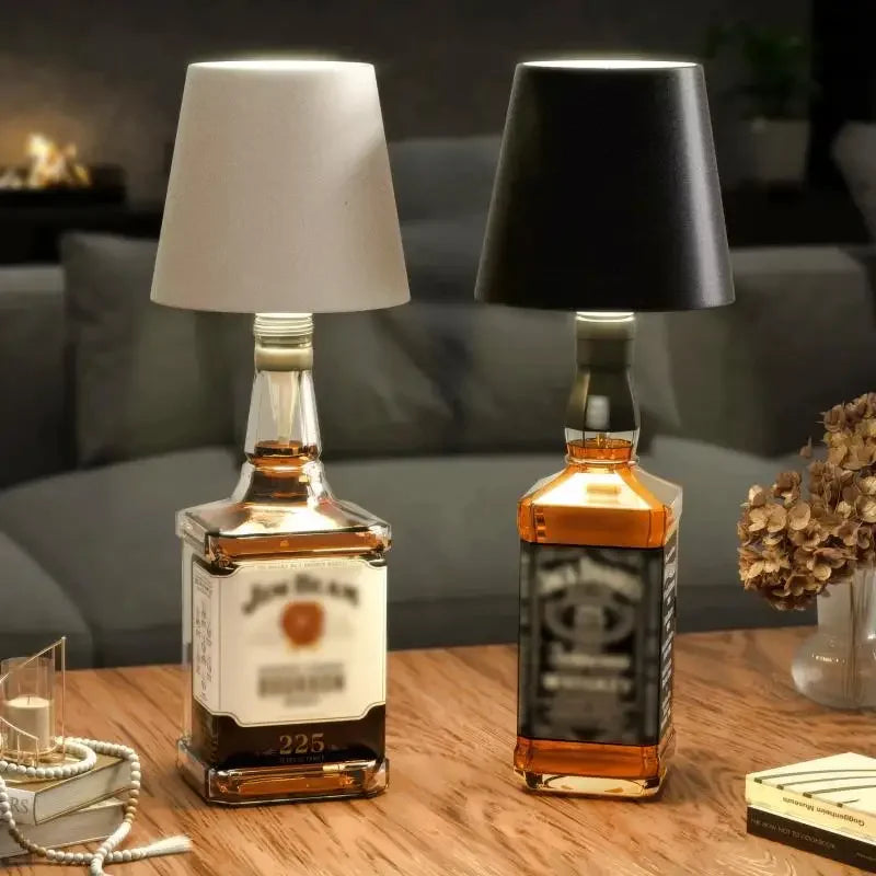 Wine bottle wireless LED lamp with white and black lampshades on a table