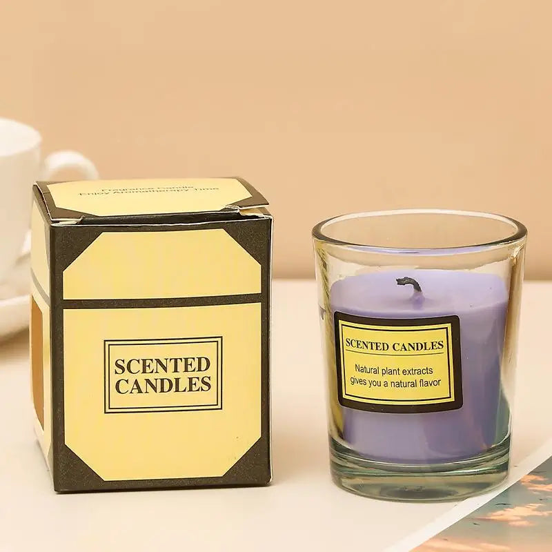 Aromatherapy candle in clear glass jar with lavender-purple wax; gift box included