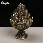 Bronze mountain incense burner on round base, front view with carved details