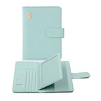 Light blue passport holder with hasp clasp, airplane emblem, and card divider slots