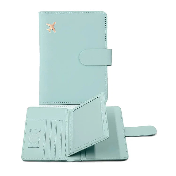 Light blue passport holder with hasp clasp, airplane emblem, and card divider slots