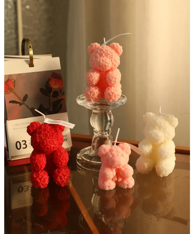 Rose bear scented candle set: pink and red bear candles beside an ivory candle