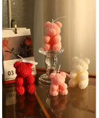 Rose bear scented candle set: pink and red bear candles beside an ivory candle