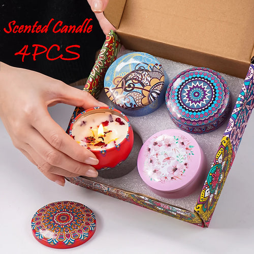 Scented candle tin set with 4 Arabian pattern lids; lit candle in red holder
