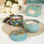 Blue vintage jar scented candle and matching patterned lid on round woven coaster