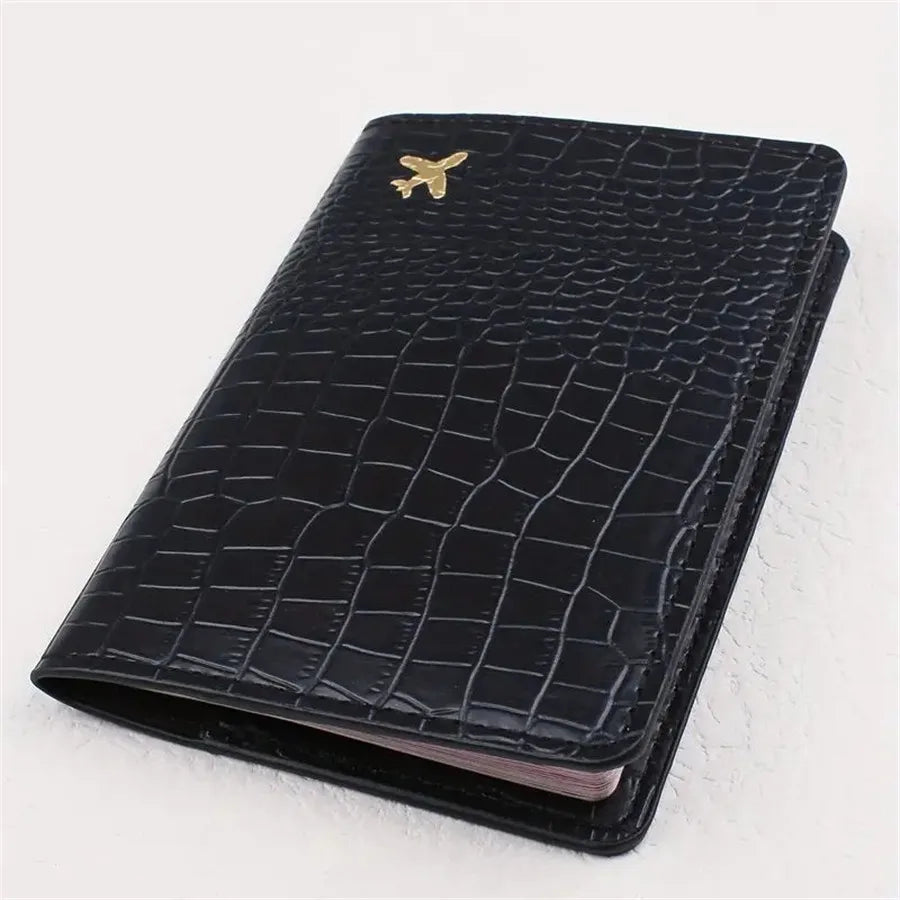 Black embossed travel passport sleeve, slim cover with gold plane emblem
