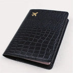 Black embossed travel passport sleeve, slim cover with gold plane emblem