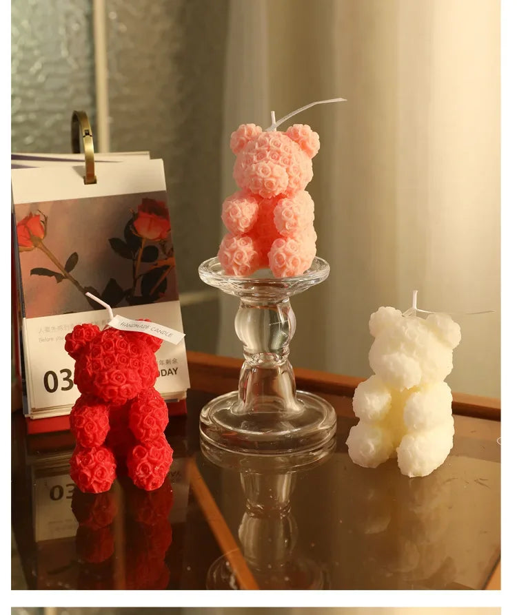 Rose bear scented candle set: red, pink, and ivory bear candles on a glass stand