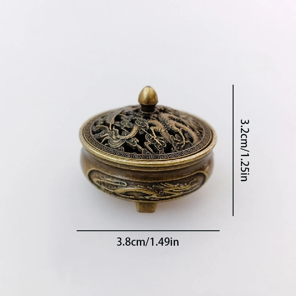 Brass pocket incense burner, 3.8cm (1.49in) tall; ornate dragon lid with finial knob