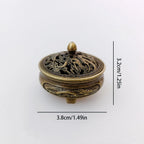 Brass pocket incense burner, 3.8cm (1.49in) tall; ornate dragon lid with finial knob