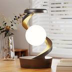 Wireless charging RGB atmosphere lamp with bright white orb and warm gold glowing light ribbon