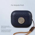 Navy leather AirPods Pro 3 case with coin-style emblem and wrist strap