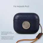 Navy leather AirPods Pro 3 case with coin-style emblem and wrist strap