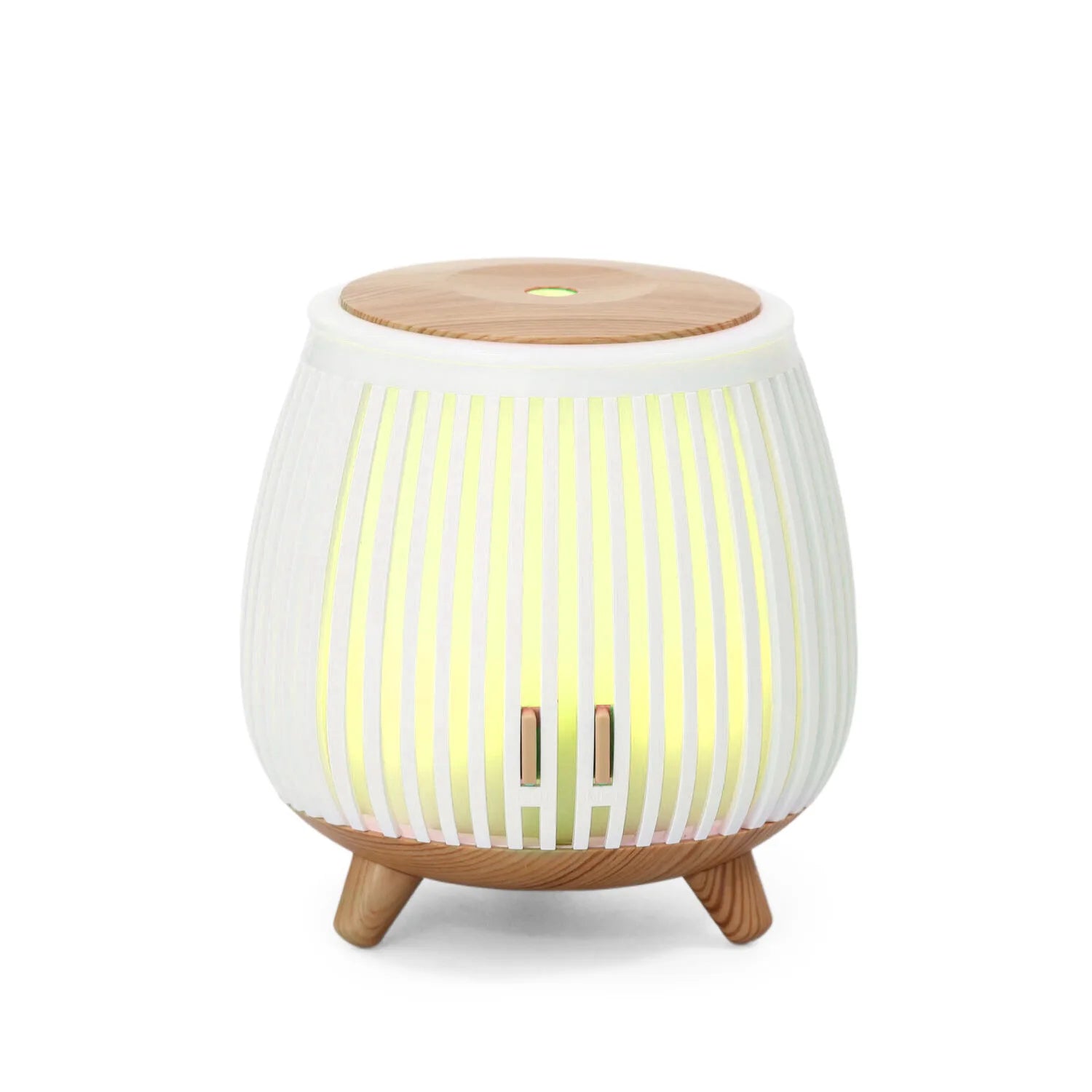 Mini ultrasonic aroma diffuser humidifier with light wood top, white striped body, green-yellow glow