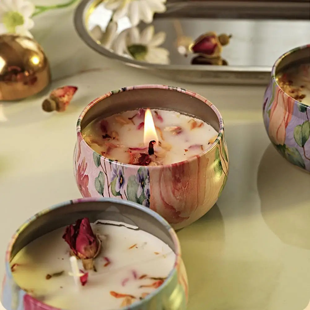 Pink floral vintage jar scented candle with flame, lid resting nearby