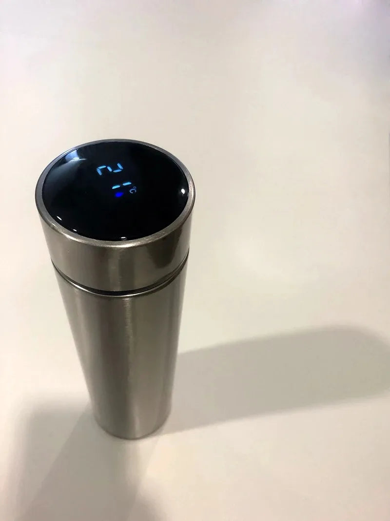 Stainless steel insulated thermos bottle with digital temperature display on lid