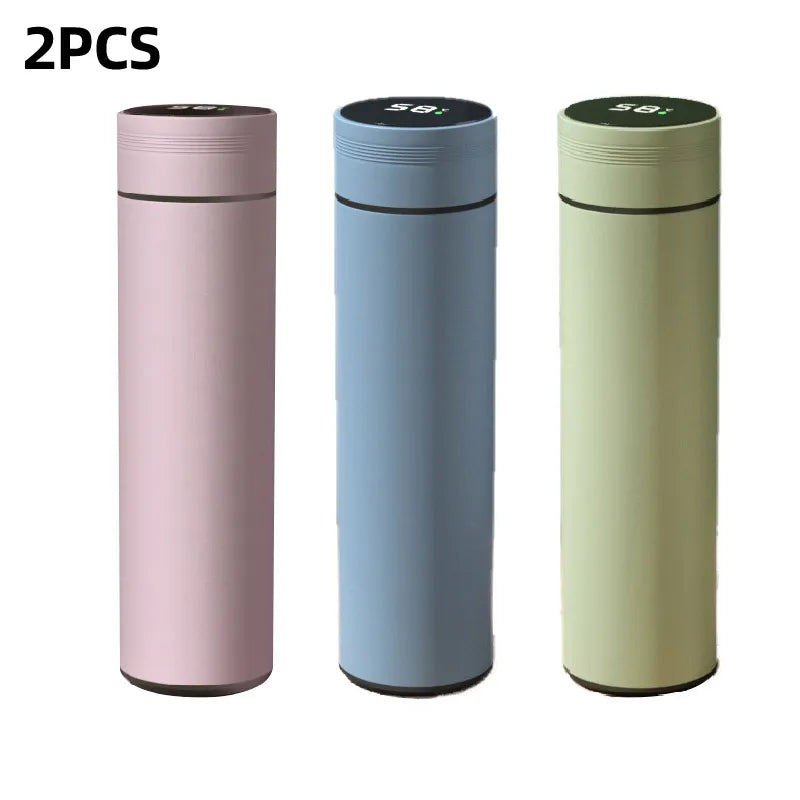 Multiple smart thermos flasks in pink, light blue, and green with lids