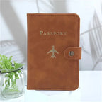 Cognac brown passport cover with “PASSPORT” and airplane emblem, side snap closure
