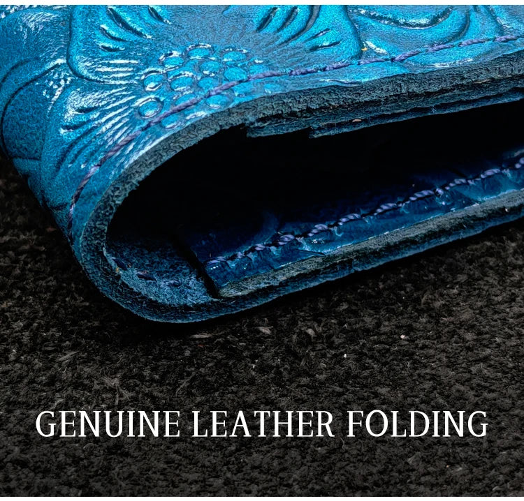 Blue leather folio edge with genuine leather folding and embossed floral detail.