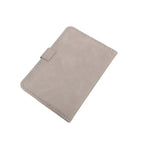 Slate gray passport cover with stitched edges and fold-over tab strap