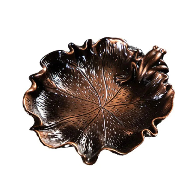 Leaf-shaped metal incense holder tray with embossed vein pattern