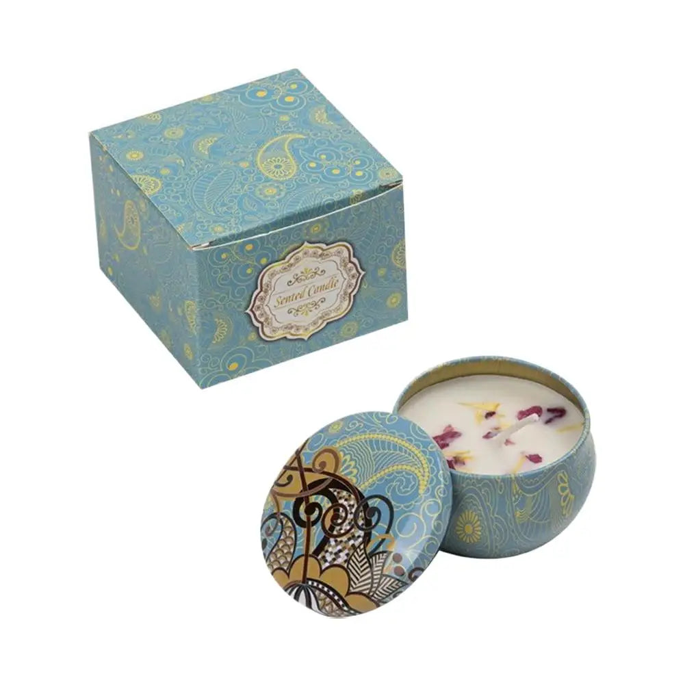 Vintage jar scented candle with blue patterned lid and pale wax with dried petals