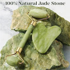 Nephrite jade roller with heart-shaped gua sha on natural jade rocks