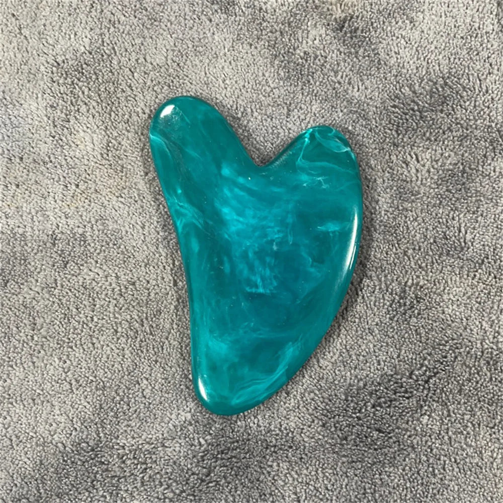 Lapis blue gua sha stone with glossy teal-blue, curved teardrop shape.