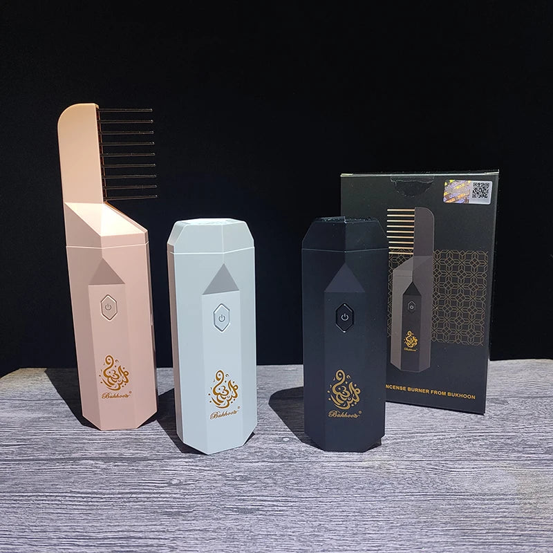 USB aromatherapy burner trio with light pink, white, and matte black bodies, plus box packaging.
