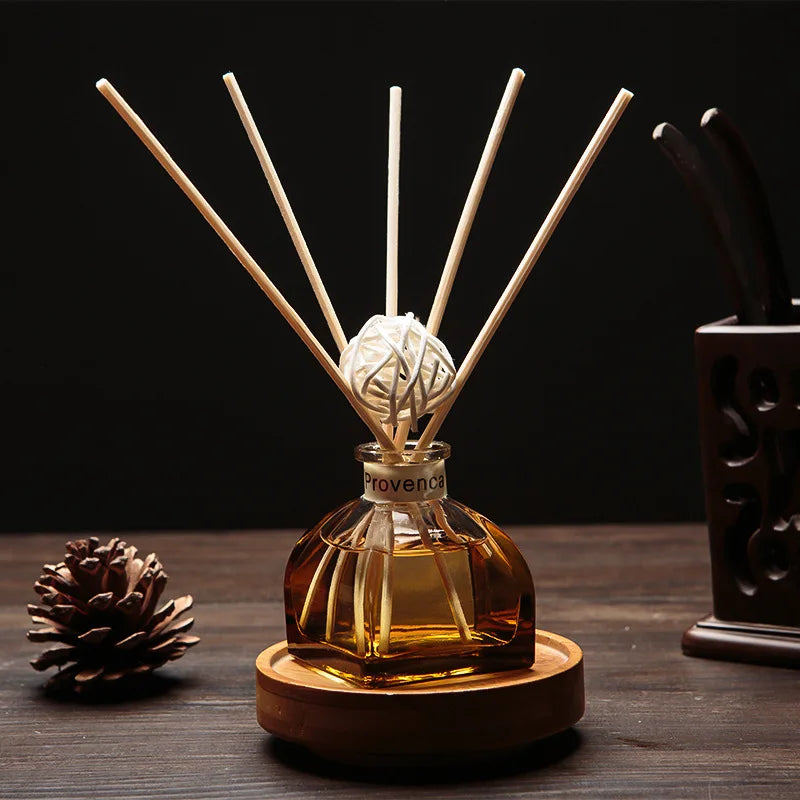 Floral reed diffuser set in amber glass bottle with 5 light wooden reeds
