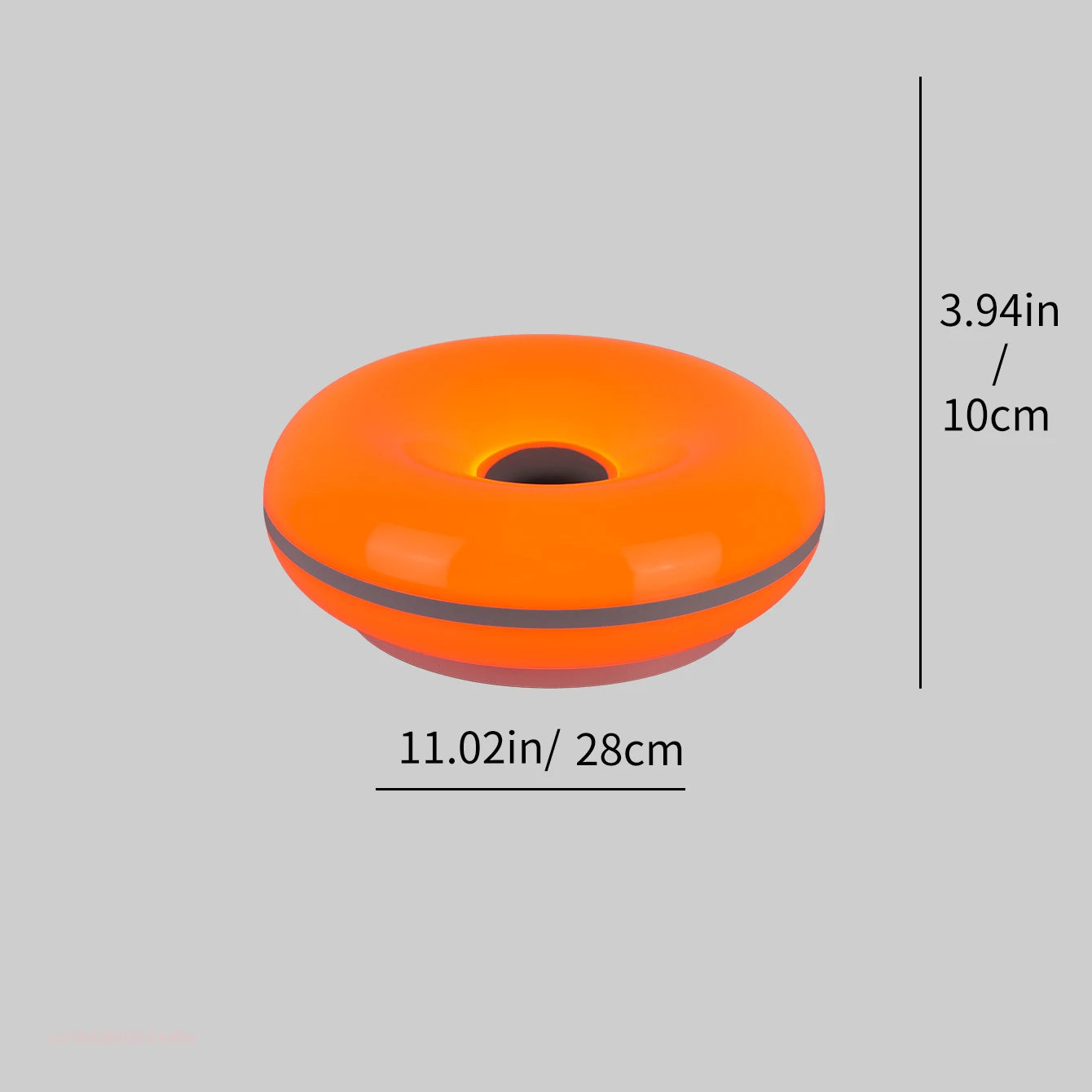 Orange donut table lamp with dark center hole, glossy rounded top.