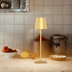 Wireless touch table lamp with yellow shade and slim gold stand