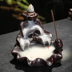 Backflow incense cone refill set with lit cone and rising incense smoke