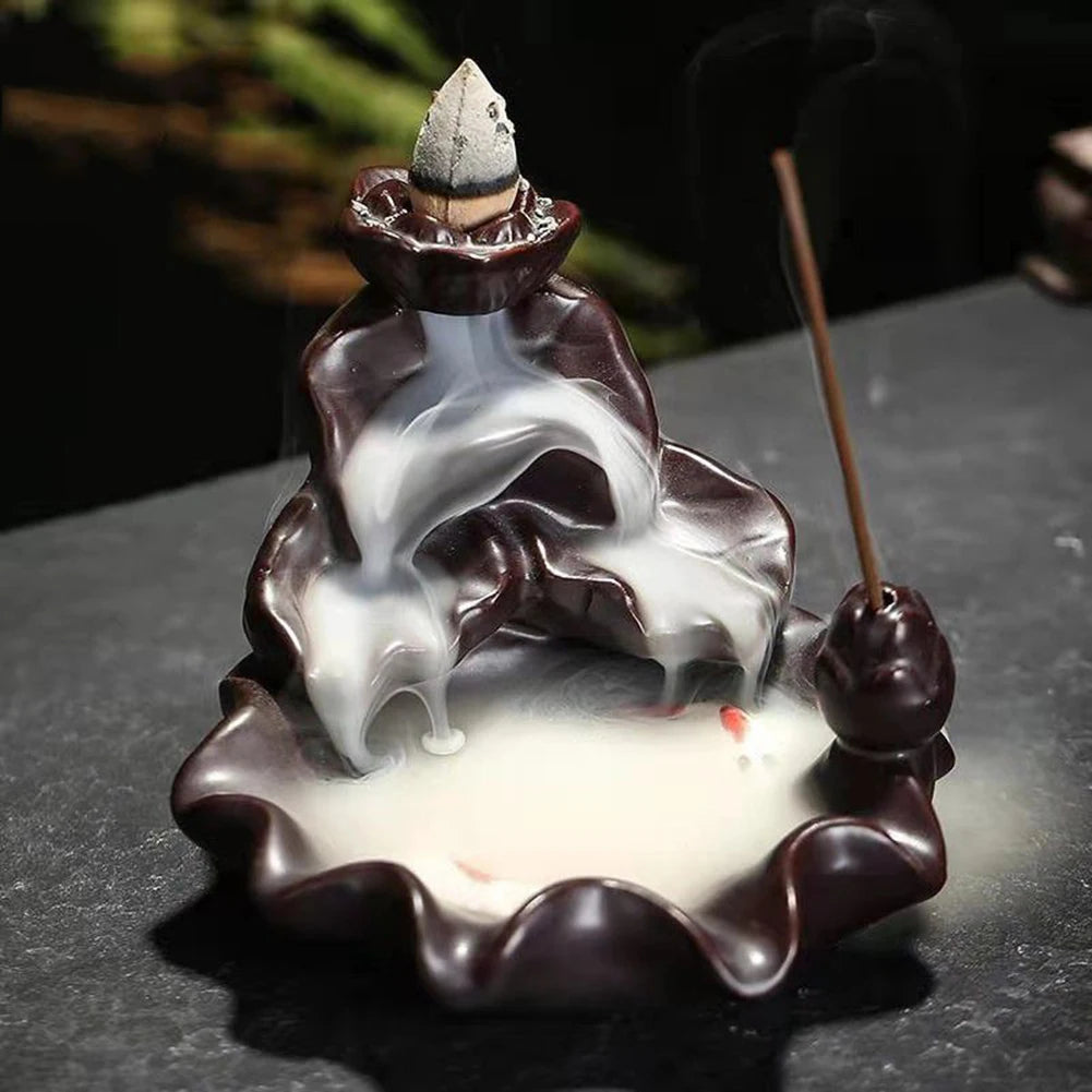 Backflow incense cone refill set with lit cone and rising incense smoke