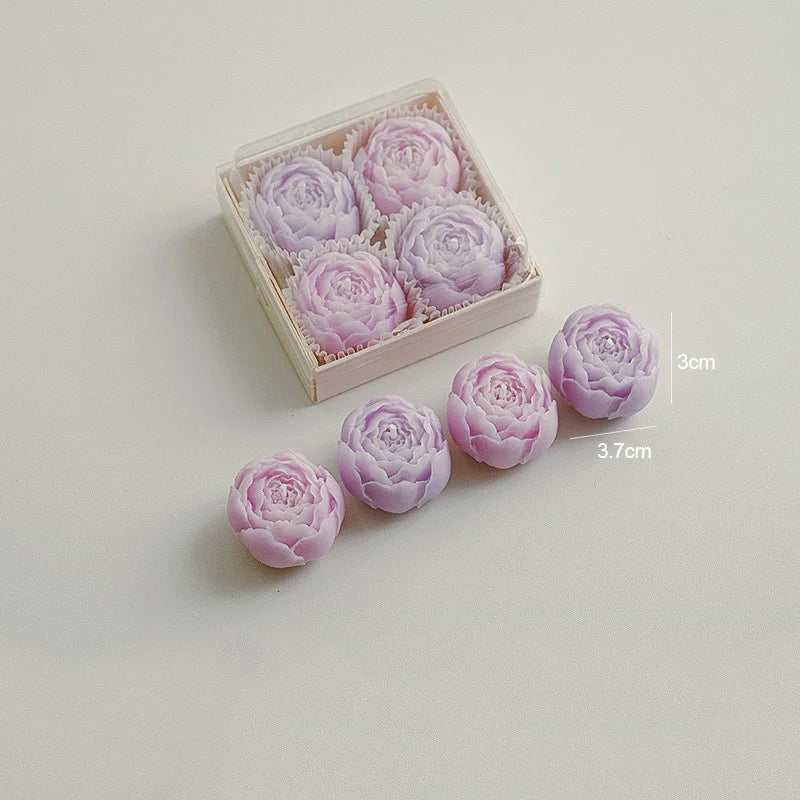 Amethyst purple rose-shaped scented candles in a gift box with loose rose candles