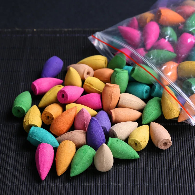Mixed-color backflow incense cones set, with cones scattered and in a clear bag