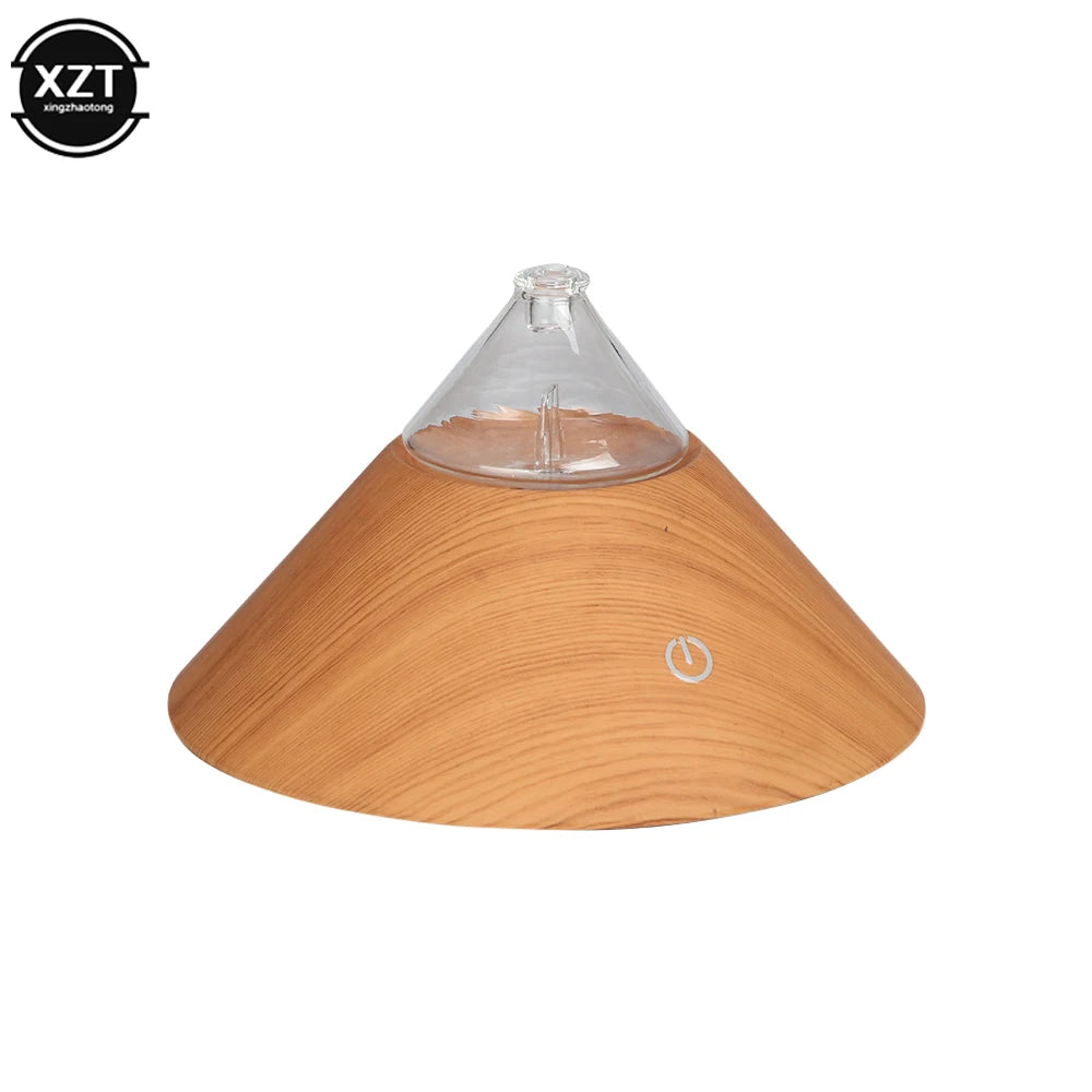 Compact wood grain aroma diffuser with clear glass top and circular power button