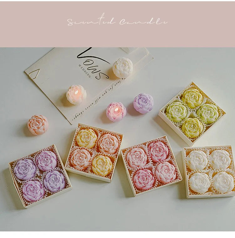 Rose-scented candle gift set with assorted pastel rose candles in open boxes
