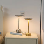 Cordless touch reading lamp, two-tone gold and dark lantern base on a tabletop
