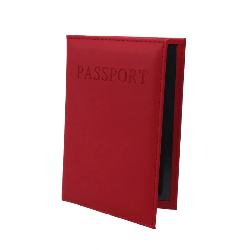 Red passport sleeve with embossed “PASSPORT” and black inner panel