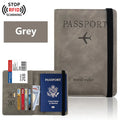 Slate grey passport wallet with elastic strap and card slots, RFID-blocking design