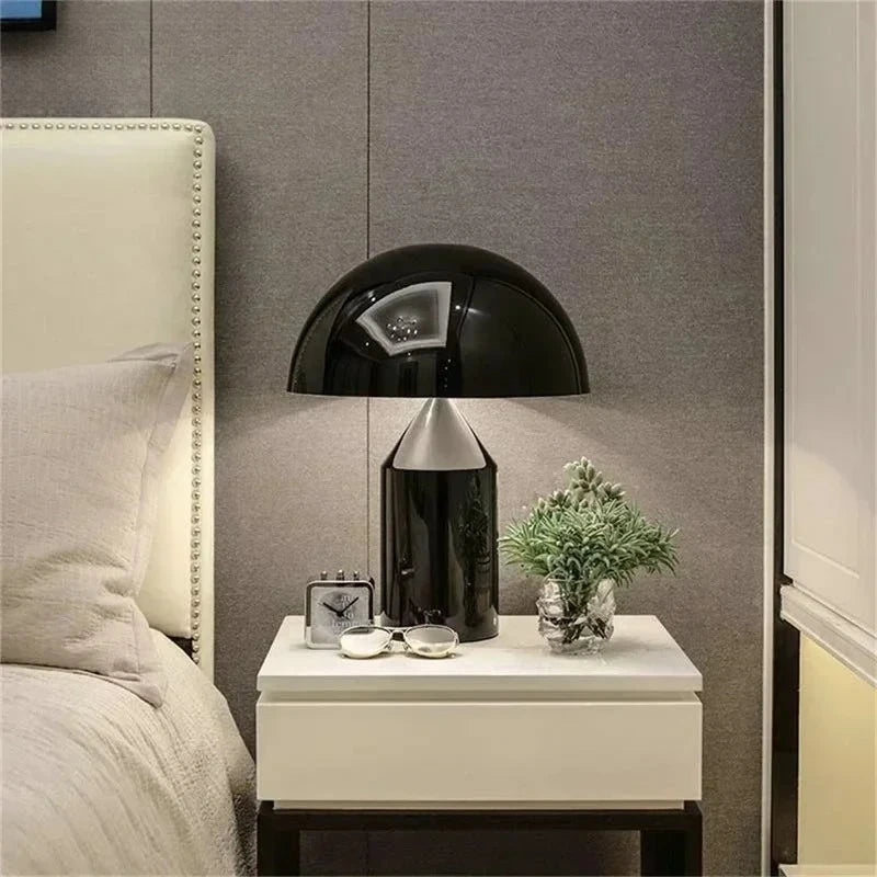 Black mushroom table lamp with domed shade and glossy black glass body
